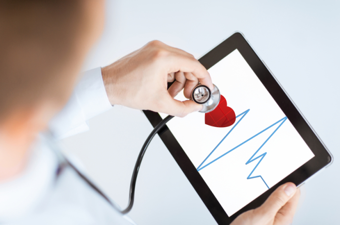 doctor with stethoscope and tablet pc