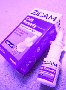 Zicam Cold Remedy nasal gel and its box on a speckled surface.