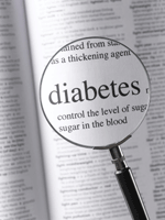 Magnifying glass highlighting the word "diabetes" in an open dictionary.