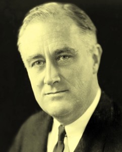 Black-and-white portrait of a middle-aged man in a suit and tie, looking at the camera.
