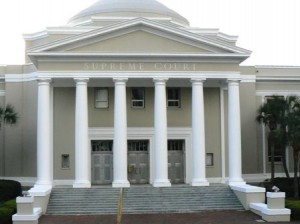 A neoclassical building with columns labeled "Supreme Court" above the entrance.