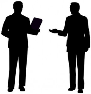 Silhouette of two people standing; one holds a folder, the other gestures with a hand.