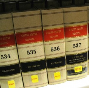 Four volumes of United States Reports, labeled 534 to 537, on a library shelf.