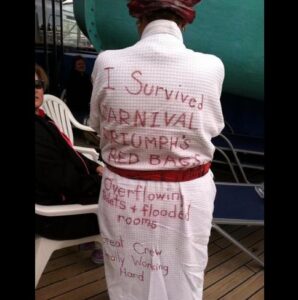 Person in a bathrobe with handwritten phrases about surviving a cruise ship mishap.