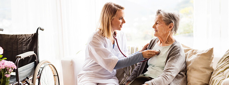 elderly woman having her vitals checked