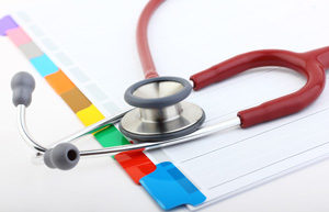 Red stethoscope on a medical file—a glimpse into a Florida medical malpractice attorney’s world.