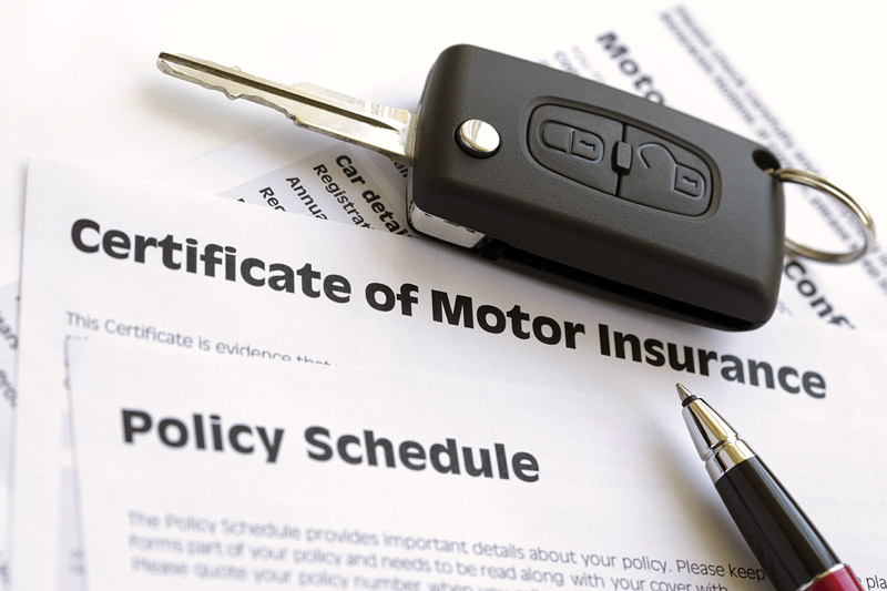Motor insurance certificate with car key