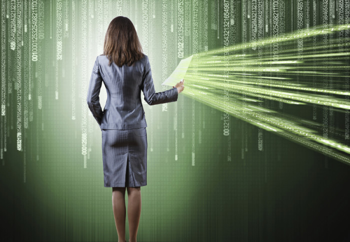 Rear view of businesswoman against binary background