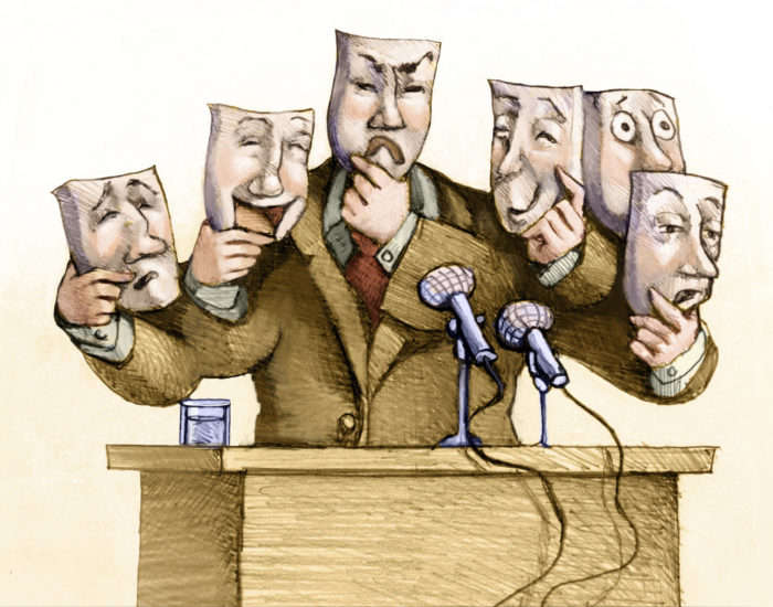 a politician speaks to the public with a set of masks