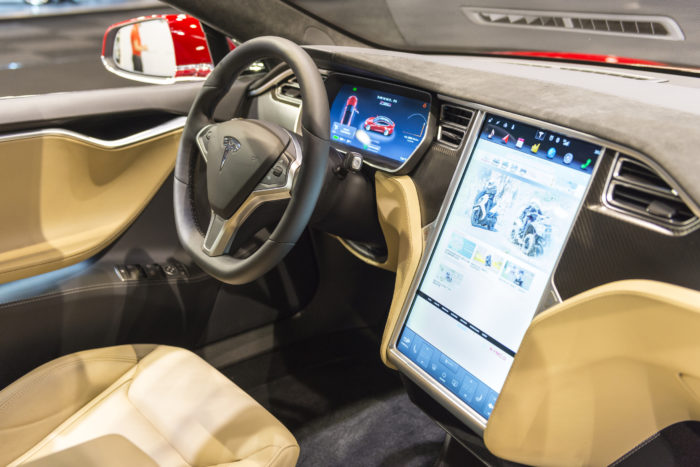 Brussels, Belgium - Januari 12, 2016: Luxurious interior on a Tesla Model S full electric luxury with a large touch screen and dashboard screen. The car is on display during the 2016 Brussels Motor Show.