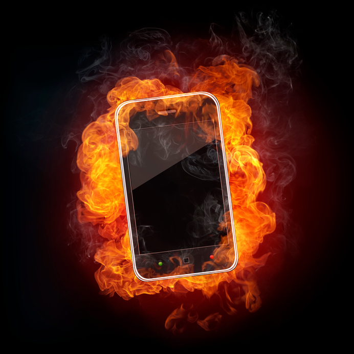Smartphone in fire Isolated on Black Background.