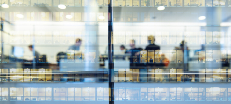 Office Building with People Working in Window