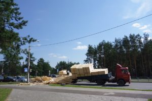 Semi truck accident with overturned cargo