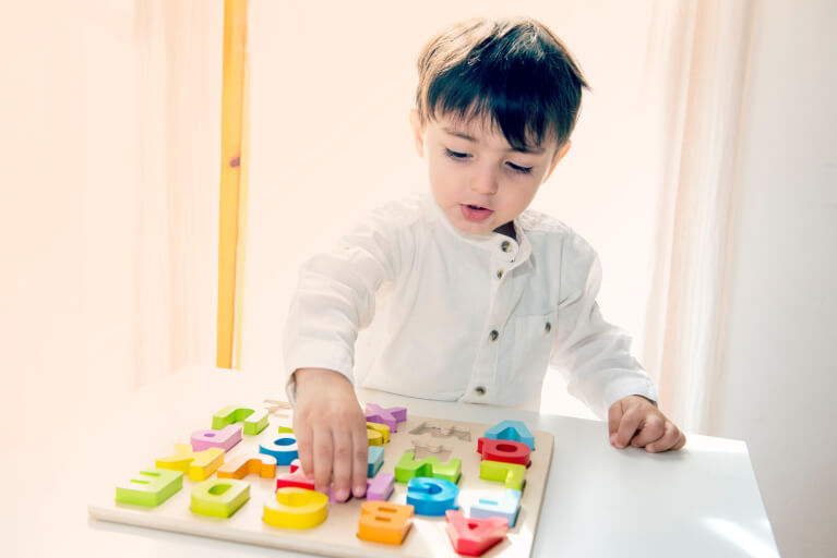 Child Playing With Toy