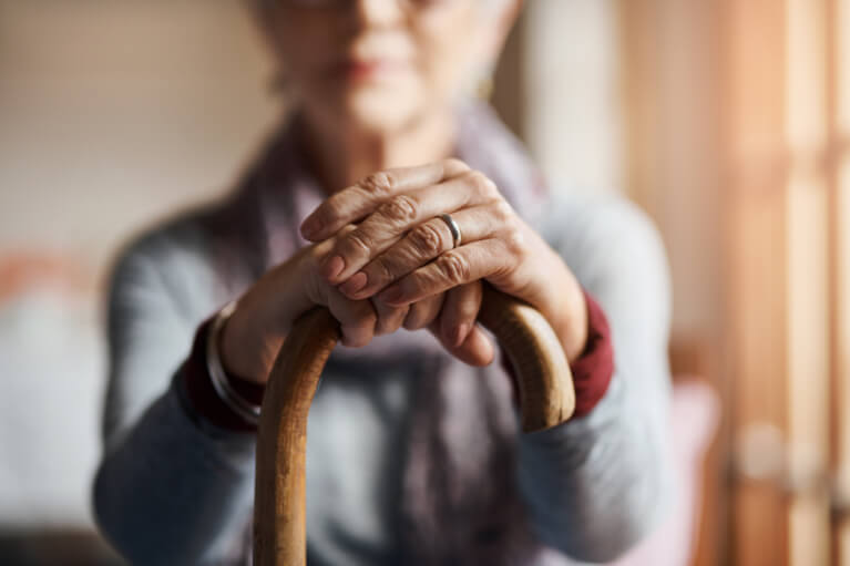 Senior Woman With Wedding Ring in Assisted Living