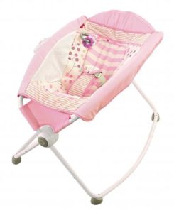 Pink and white baby rocker with a fabric seat and metal frame.