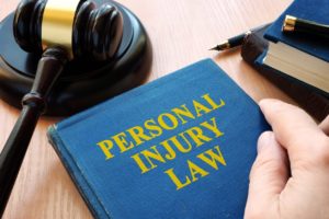 personal injury law book with gavel 