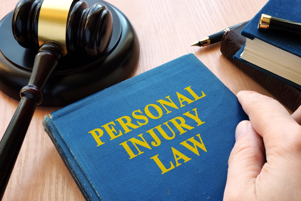 personal injury law book with gavel