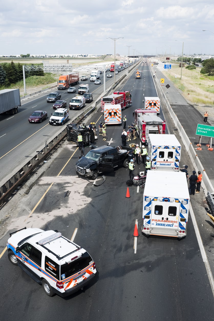 Ambulances and police in highway after serious car crash