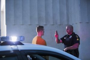 Police conduct field sobriety test on drunk driver 