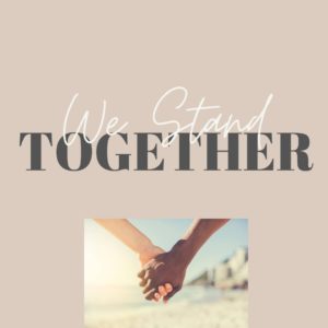 Two people holding hands with text "We Stand TOGETHER" above them on a beige background.