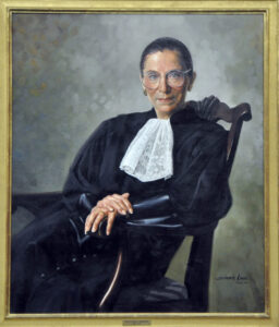 A painted portrait of a woman in judicial robes sitting in a wooden chair.