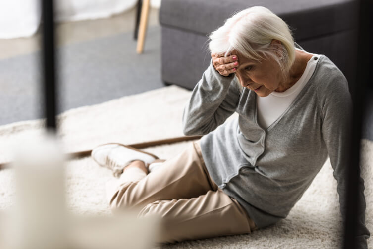 Elderly woman in pain after a slip and fall