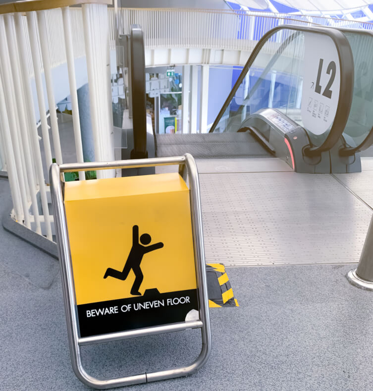 Warning sign for escalator accidents