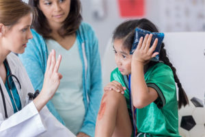 Child injury evaluated by doctor