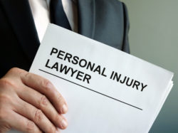 Personal injury lawyer with clipboard and law.