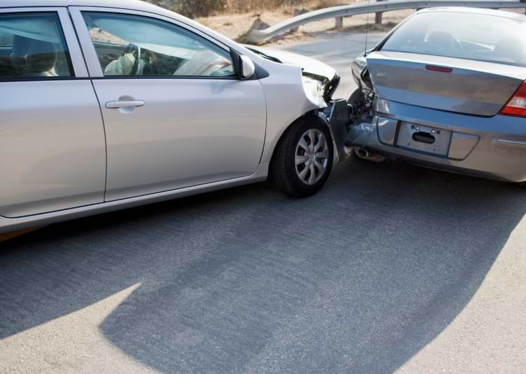Two cars invovled in car accident rear end collision on roadway
