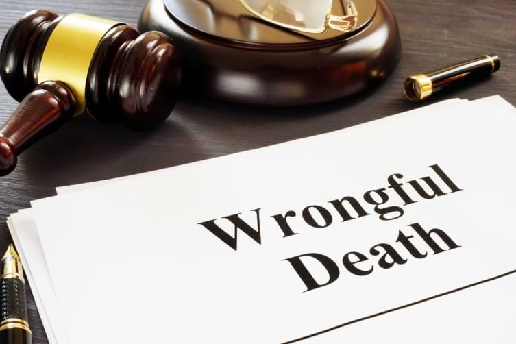 Wrongful Death claim on clipboard next to court gavel on a table