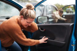 Female Motorist In Crash For Crash Insurance Fraud Getting Out Of Car
