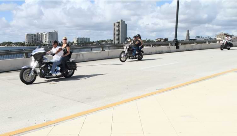 Motorcycle riders cross Royal Palm bridge in West Palm Beach Florida 