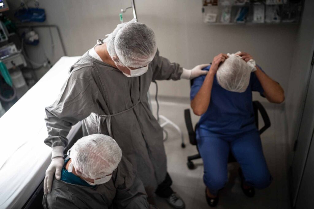 team of surgeons devastated in operating room after a surgical error




