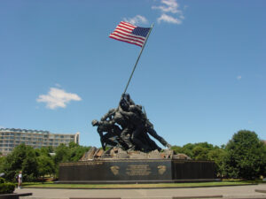 Statue of soldiers raising the U.S. flag, Iwo Jima Memorial, on a clear day.