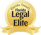 Gold seal displaying "Florida Trend's Florida Legal Elite" in black and brown text.